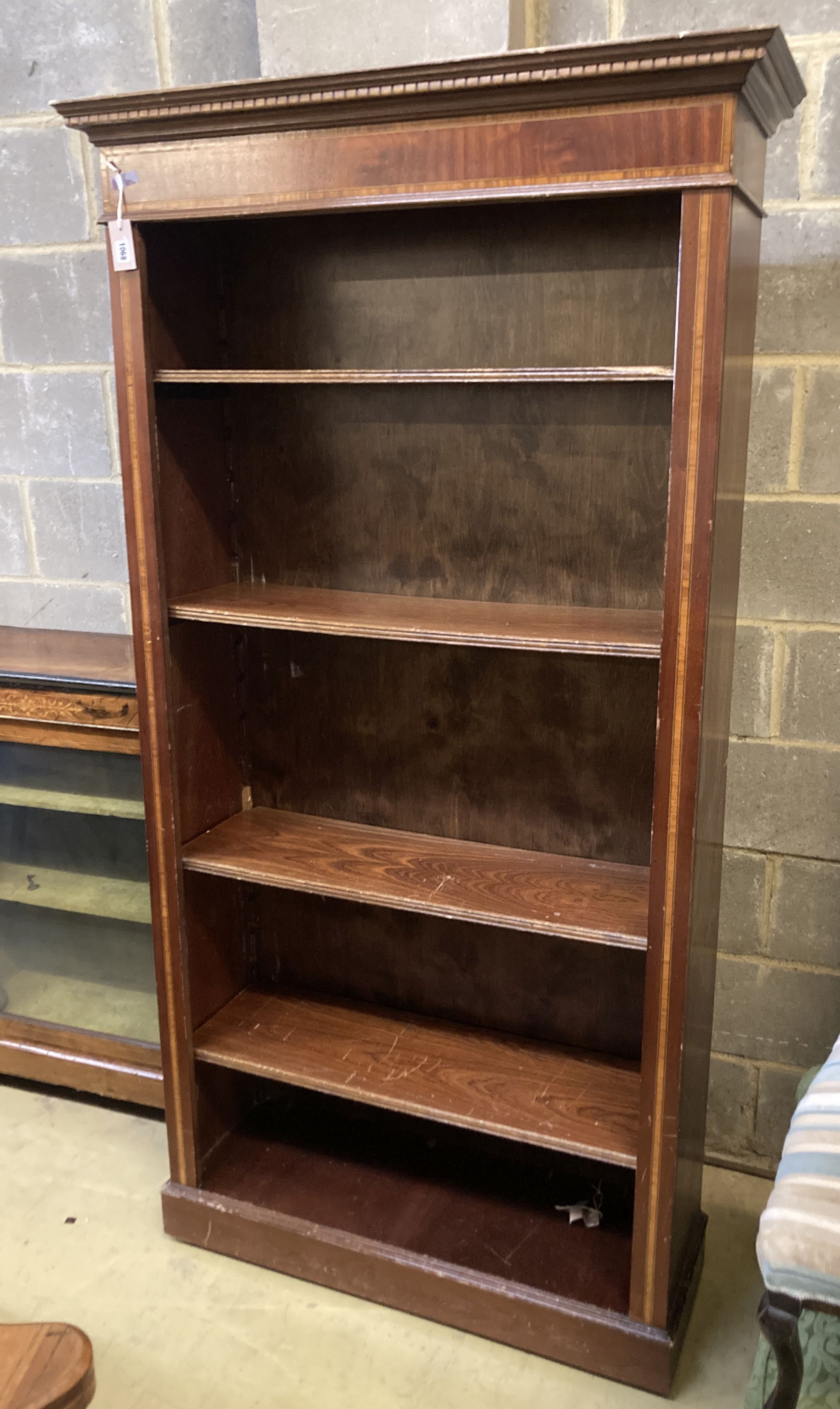 An Edwardian style satinwood banded mahogany open bookcase, length 104cm, depth 35cm, height 199cm